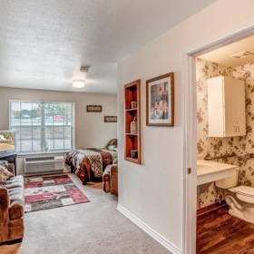 Generous living spaces to relax and unwind a bathroom with a bed and a toilet