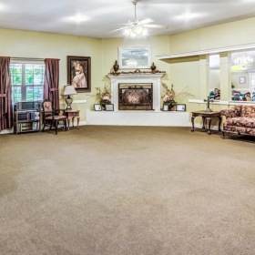 Settle into comfort at Laurel Glen at Stephenville Assisted Living & Memory Care a living room with a fireplace